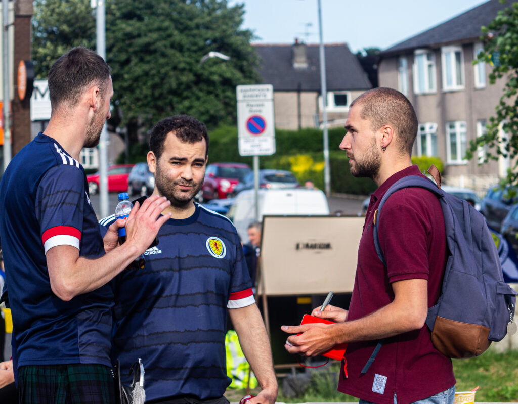 Karlo Tasler talking to Scottish fans in Glasgow
